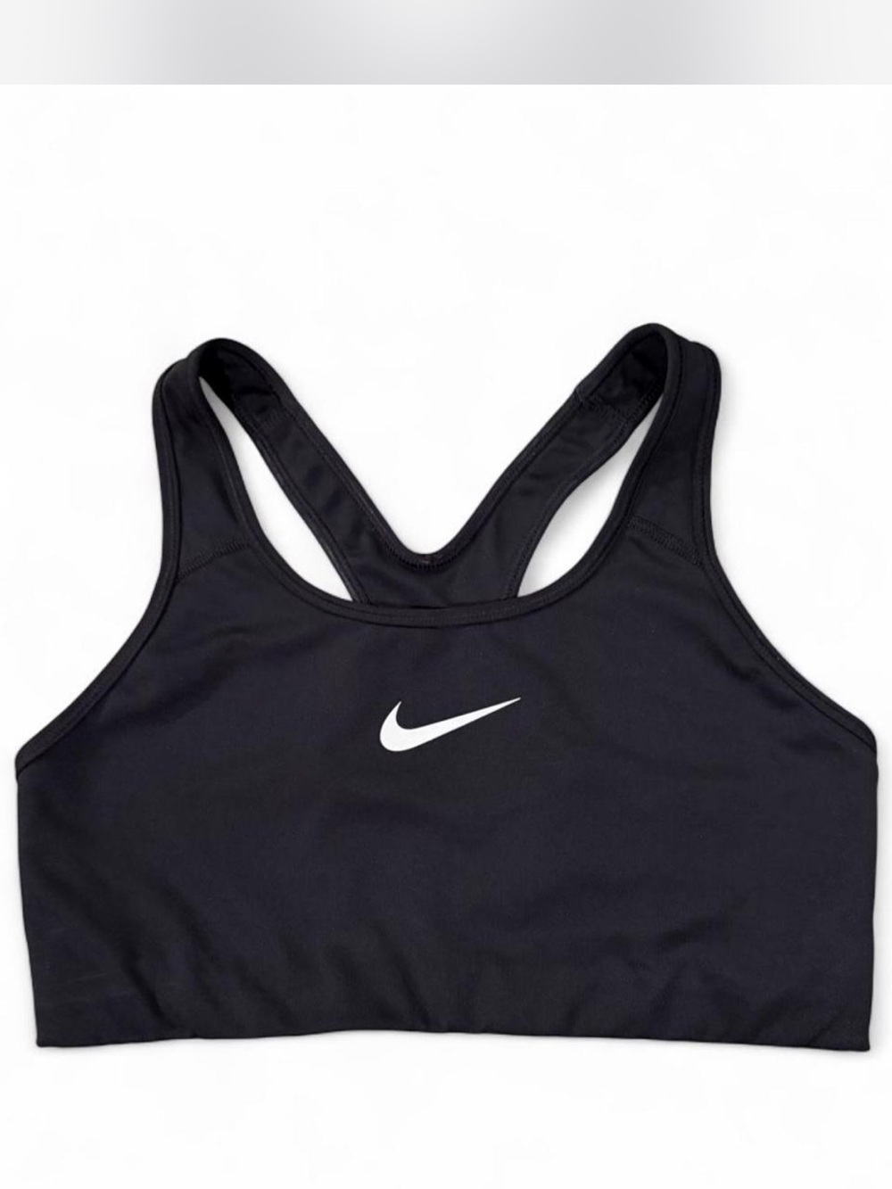 Nike women’s Sz. L black sports bra with white swoosh on front